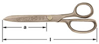 A pair of bronze metal shears with a measurement scale beneath them labeled "a," indicating the length of the blade. The shears have a screw at the pivot point, with one looped handle larger than the other.