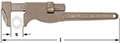 A bronze metal adjustable railroad wrench with a marking labeled 'S' indicating the opening width. The monkey wrench has a serrated knob for adjusting the jaw size and a faint hexagonal nut image inside the fixed jaw. The handle is straight with a rounded